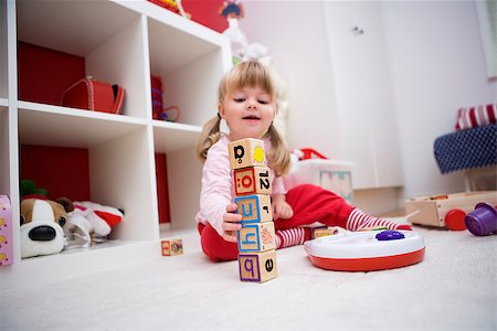 Baby girl playing in her room Stock Photo - Budget Royalty-Free & Subscription, Code: 400-08032413