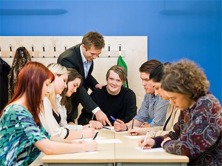 Teacher and young Adult students in the classroom Stock Photo - Budget Royalty-Free & Subscription, Code: 400-08032696