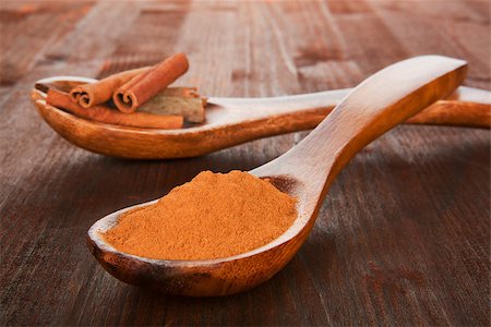 simsearch:400-04791848,k - Cinnamon concept. Sticks and powder on wooden spoons on wooden background. Aromatic culinary spices. Stock Photo - Budget Royalty-Free & Subscription, Code: 400-08033128