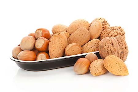 simsearch:400-04181279,k - Almond, hazelnut and walnuts in bowl isolated on white background. Healthy snack concept. Foto de stock - Super Valor sin royalties y Suscripción, Código: 400-08033120