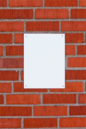 Brick wall with a blank sign Stock Photo - Budget Royalty-Free & Subscription, Code: 400-08033592