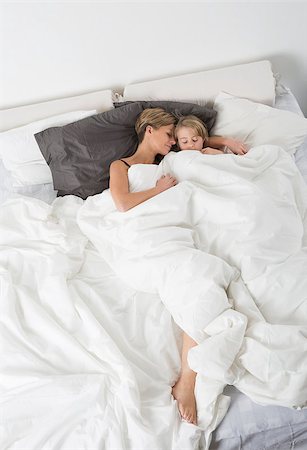sleeping bed full body - Mother and Daughter sleeping in a white bedroom from high angle view Stock Photo - Budget Royalty-Free & Subscription, Code: 400-08033721