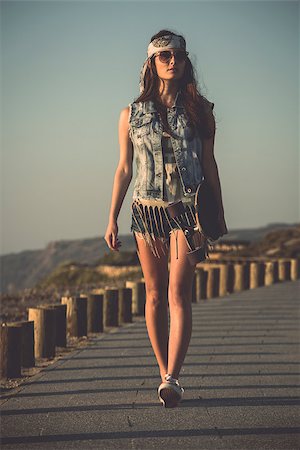 swag - Beautiful skate girl walking while holding a skateboard Stock Photo - Budget Royalty-Free & Subscription, Code: 400-08033865