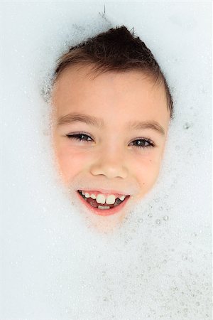 Seven years boy in a bubble bath filled with soap foam Stock Photo - Budget Royalty-Free & Subscription, Code: 400-08044144