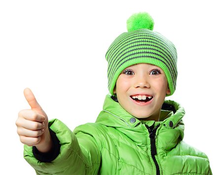 Green hat and jacket clothing boy showing thumb up on white background Stock Photo - Budget Royalty-Free & Subscription, Code: 400-08044148