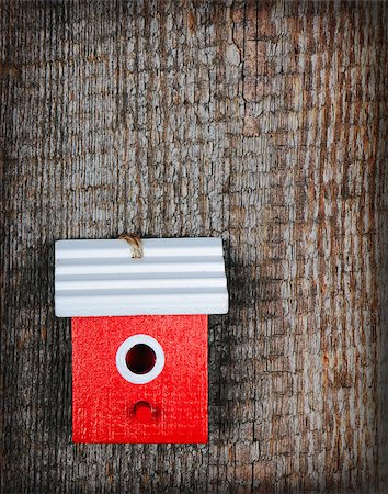 simsearch:400-06520273,k - One birdhouse painted with red and white colors on old wooden background Stock Photo - Budget Royalty-Free & Subscription, Code: 400-08044161