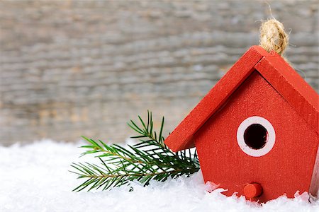One birdhouse on snow with wooden background Stock Photo - Budget Royalty-Free & Subscription, Code: 400-08044163