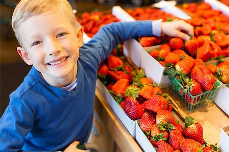 little and proud boy helping with grocery shopping, healthy lifestyle concept Stock Photo - Budget Royalty-Free & Subscription, Code: 400-08044793