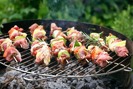 flame grilled chicken photography - Summer barbecue. Meat BBQ with herbs and vegetables. Outdoor grill food Stock Photo - Budget Royalty-Free & Subscription, Code: 400-08045069