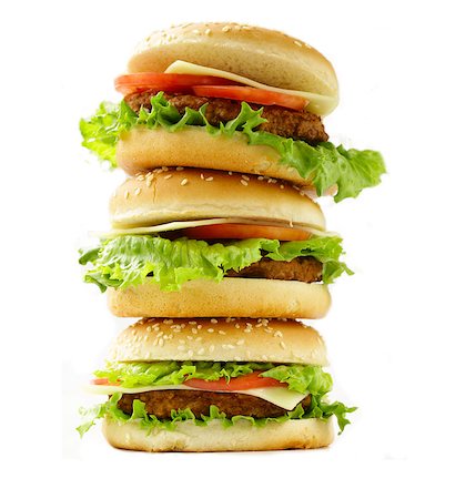 simsearch:400-07407920,k - traditional cheeseburger with green lettuce and tomatoes Photographie de stock - Aubaine LD & Abonnement, Code: 400-08047271