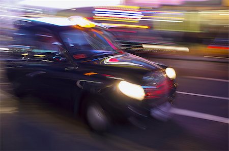 Abstract blurry image of a London taxi cab driving on a street. Stock Photo - Budget Royalty-Free & Subscription, Code: 400-08047584