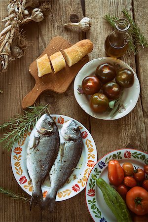 Healthy eating. Bream fish preparation. Seafood with vegetables Stockbilder - Microstock & Abonnement, Bildnummer: 400-08047591