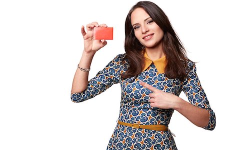 Beautiful woman in colorfull dress holding empty credit card and pointing at it,  isolated on white Fotografie stock - Microstock e Abbonamento, Codice: 400-08048049