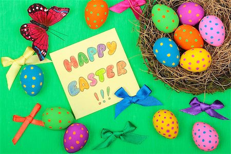 simsearch:400-08036453,k - Easter greeting card with eggs, bows and butterfly on green background Stock Photo - Budget Royalty-Free & Subscription, Code: 400-08048337