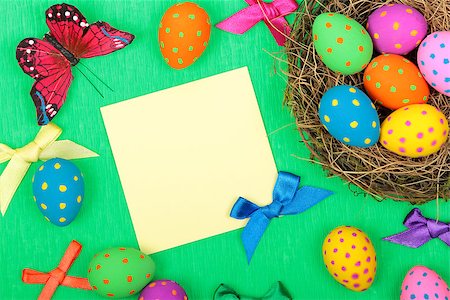 simsearch:400-08036453,k - Easter greeting card with eggs, bows and butterfly on green background Stock Photo - Budget Royalty-Free & Subscription, Code: 400-08048339