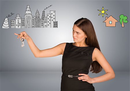 simsearch:400-08031960,k - Woman making choice between city and country, looking at keys in her hand, on gray background Stock Photo - Budget Royalty-Free & Subscription, Code: 400-08040335