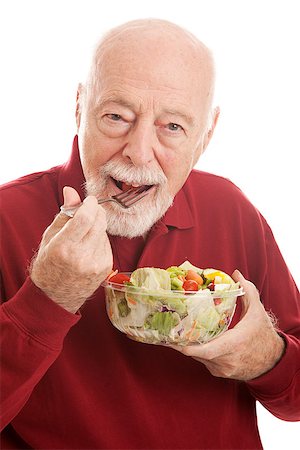 simsearch:632-06029430,k - Fit senior man eating a healthy salad for lunch.  White background. Stock Photo - Budget Royalty-Free & Subscription, Code: 400-08040642