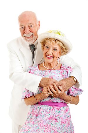 simsearch:400-08040653,k - Portrait of an elderly couple with the husband embracing his beautiful wife.  Isolated on white. Stock Photo - Budget Royalty-Free & Subscription, Code: 400-08040652