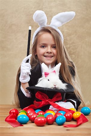 simsearch:400-08036284,k - Conjuring the easter rabbit - young magician perform a seasonal trick Stockbilder - Microstock & Abonnement, Bildnummer: 400-08043106