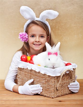 simsearch:400-08036285,k - Happy spring girl with easter basket - holding colorful eggs and white rabbit Stockbilder - Microstock & Abonnement, Bildnummer: 400-08043107