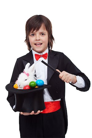 simsearch:400-08036285,k - Young magician performing an easter trick - pulling a white rabbit and colorful eggs from the hat Stockbilder - Microstock & Abonnement, Bildnummer: 400-08043115