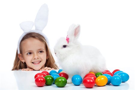 simsearch:400-08036285,k - Happy little girl with her easter bunny - smiling and enjoying the magic, isolated Stockbilder - Microstock & Abonnement, Bildnummer: 400-08043111