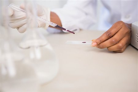 simsearch:400-08055390,k - Scientist working attentively with pipette in laboratory Stock Photo - Budget Royalty-Free & Subscription, Code: 400-08055359