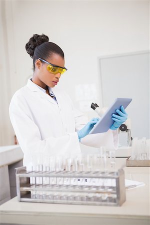 simsearch:400-08055390,k - Concentrated scientist working with tablet in laboratory Stock Photo - Budget Royalty-Free & Subscription, Code: 400-08055365