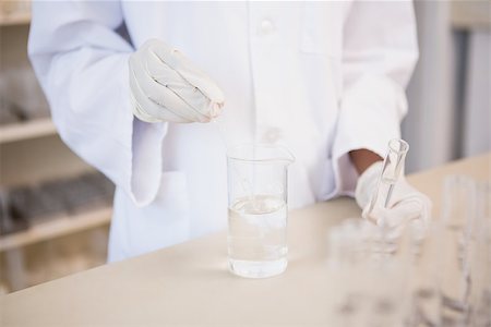 simsearch:400-08055357,k - Scientist examining test tube and beaker in laboratory Stock Photo - Budget Royalty-Free & Subscription, Code: 400-08055383