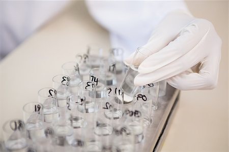 simsearch:400-08055396,k - Scientist analyzing test tubes in laboratory Stock Photo - Budget Royalty-Free & Subscription, Code: 400-08055398