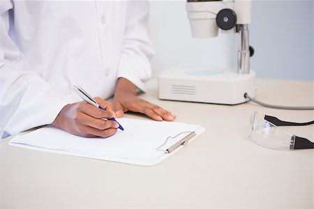 simsearch:400-08055357,k - Concentrated scientist taking notes in laboratory Stock Photo - Budget Royalty-Free & Subscription, Code: 400-08055406