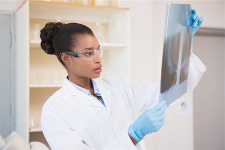simsearch:400-08055390,k - Concentrated scientist looking at x-ray in laboratory Stock Photo - Budget Royalty-Free & Subscription, Code: 400-08055407