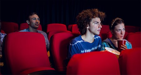 Young friends watching a film at the cinema Stock Photo - Budget Royalty-Free & Subscription, Code: 400-08055660
