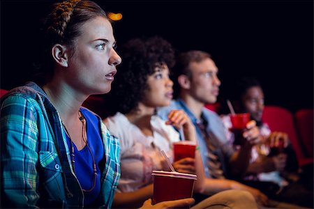 Young friends watching a film at the cinema Stock Photo - Budget Royalty-Free & Subscription, Code: 400-08055670