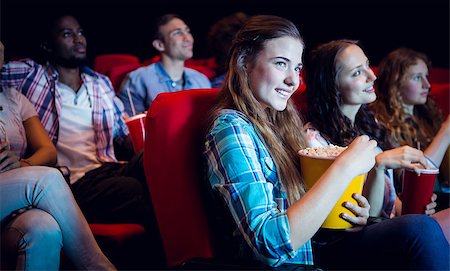 Young friends watching a film at the cinema Stock Photo - Budget Royalty-Free & Subscription, Code: 400-08055701