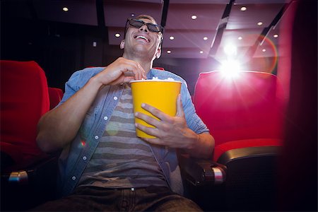 Happy young man watching a 3d film at the cinema Stock Photo - Budget Royalty-Free & Subscription, Code: 400-08055741