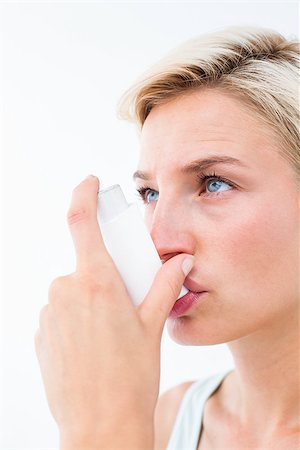 photo inhaler person - Blonde woman taking her inhaler on white background Stock Photo - Budget Royalty-Free & Subscription, Code: 400-08056127