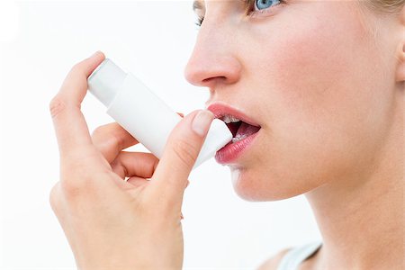 photo inhaler person - Blonde woman taking her inhaler on white background Stock Photo - Budget Royalty-Free & Subscription, Code: 400-08056128