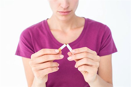 simsearch:400-06876304,k - Pretty woman breaking a cigarette on white background Stock Photo - Budget Royalty-Free & Subscription, Code: 400-08056196