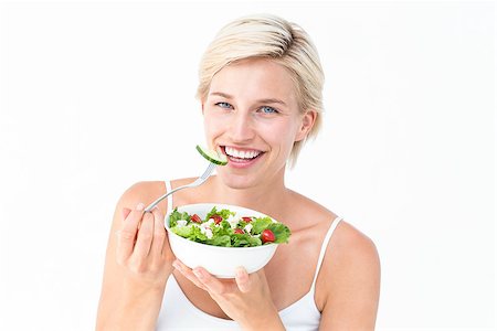 fresh vegetables for salad on white - Beautiful blonde woman eating salad on white background Stock Photo - Budget Royalty-Free & Subscription, Code: 400-08056227