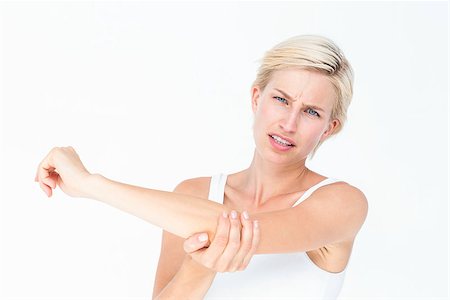 simsearch:400-07138263,k - Pretty woman suffering from elbow pain on white background Stock Photo - Budget Royalty-Free & Subscription, Code: 400-08056294