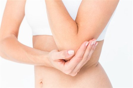 simsearch:400-06690149,k - Woman suffering from elbow pain on white background Stock Photo - Budget Royalty-Free & Subscription, Code: 400-08056296