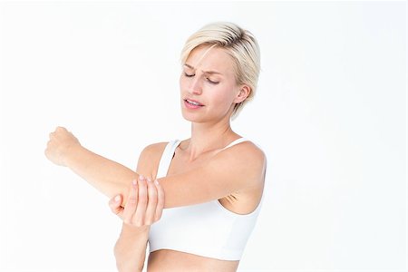 simsearch:400-07138263,k - Suffering woman touching her sore elbow on white background Stock Photo - Budget Royalty-Free & Subscription, Code: 400-08056292