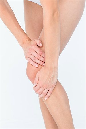 simsearch:400-07138263,k - Woman with knee pain on white background Stock Photo - Budget Royalty-Free & Subscription, Code: 400-08056310