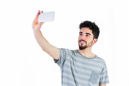 screen shot of phone - Casual man taking a selfie shot in studio Stock Photo - Budget Royalty-Free & Subscription, Code: 400-08056409