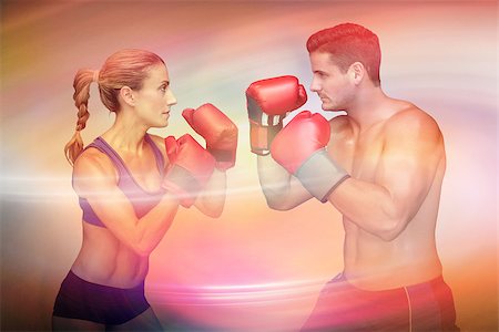 Boxing couple   against purple and orange sky Stock Photo - Budget Royalty-Free & Subscription, Code: 400-08056507