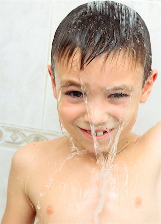 poured on her head - Seven years boy washing in the shower Stock Photo - Budget Royalty-Free & Subscription, Code: 400-08051414