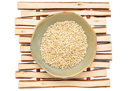 simsearch:400-07300783,k - sprouted brown rice in a ceramic bowl on a wood stick trivet Stockbilder - Microstock & Abonnement, Bildnummer: 400-08051998