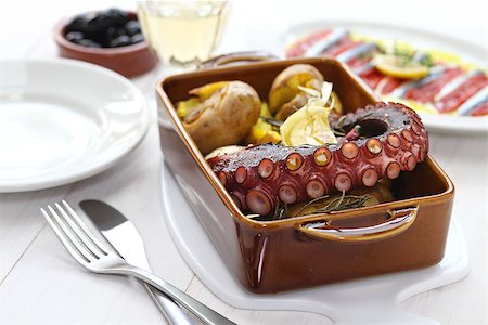 grilled octopus with potatoes, polvo a lagareiro com batata a murro, Portuguese cuisine isolated on white background Stock Photo - Budget Royalty-Free & Subscription, Code: 400-08052305