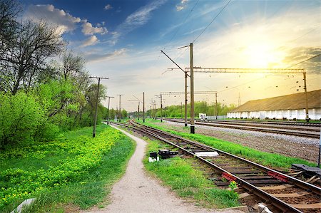 railroad crossing sign - Electric poles on a railway station at sunrise Stock Photo - Budget Royalty-Free & Subscription, Code: 400-08052455